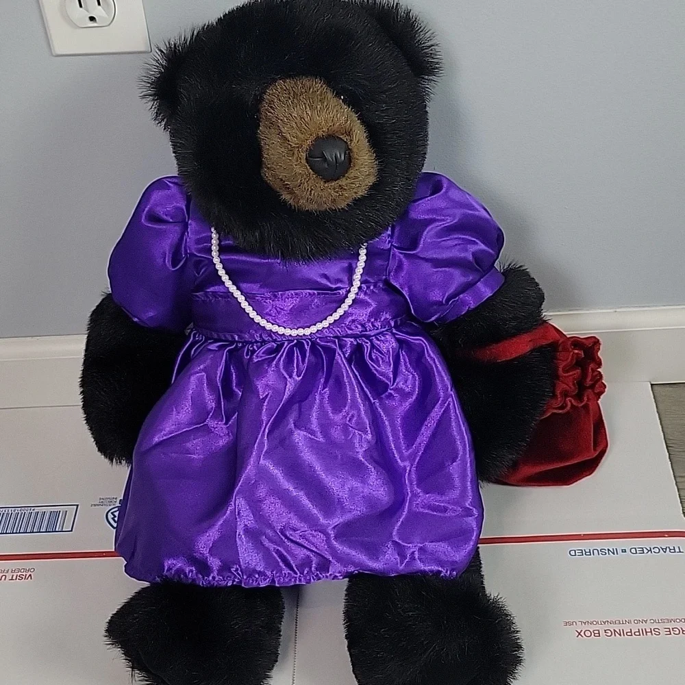 Bronner's Ditz Design Plush Bear wearing pearls and purple dress